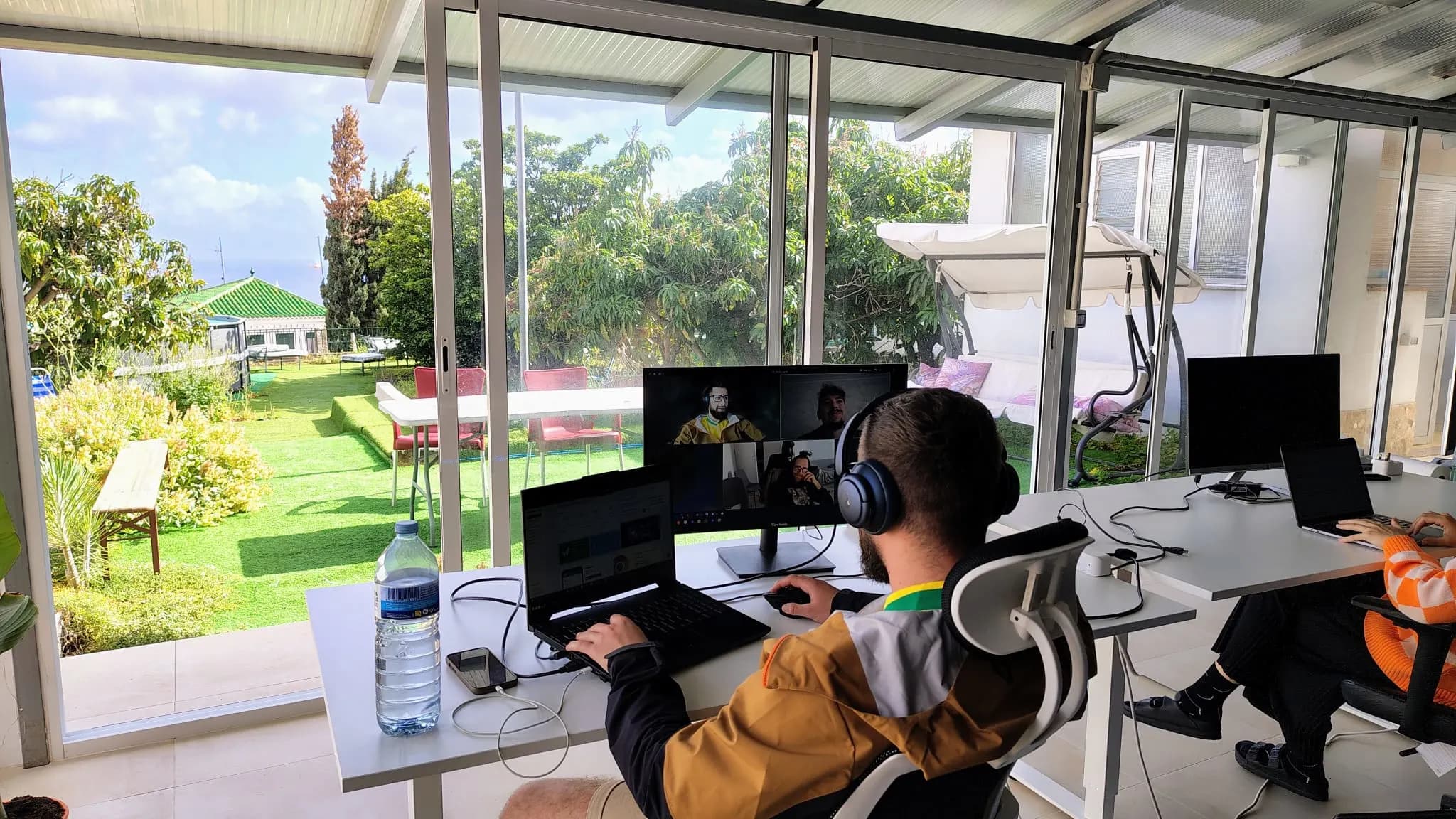 Coworking workstation with daylight and garden views.