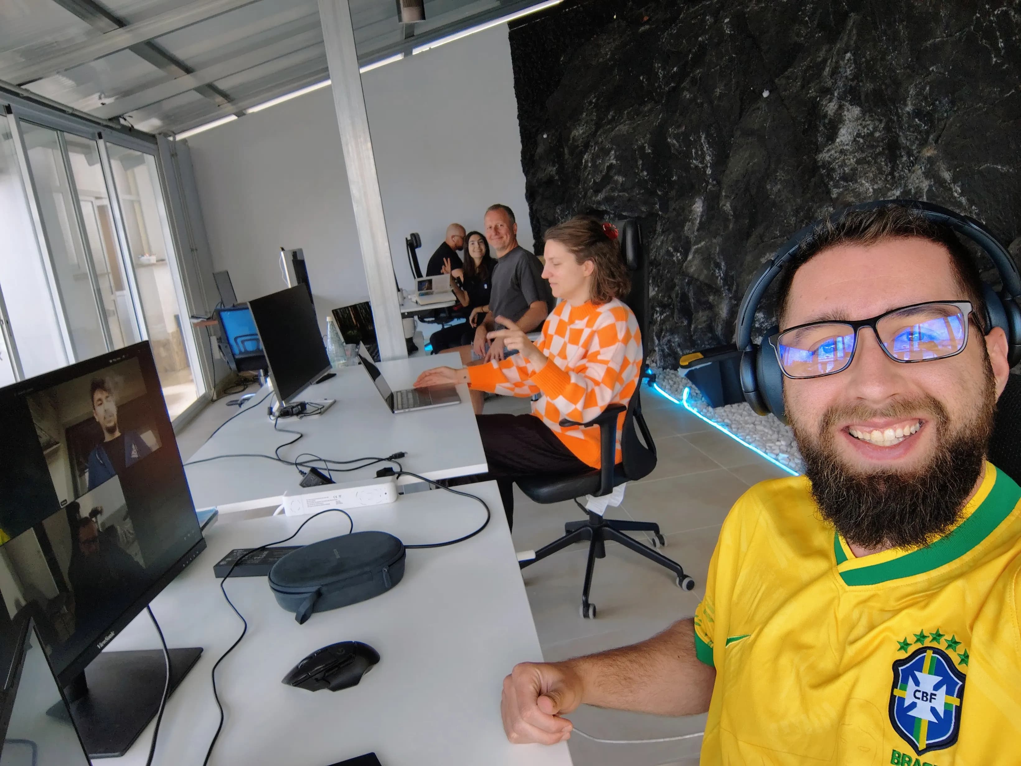Vertical view of desks and volcanic rock inside the coworking space.