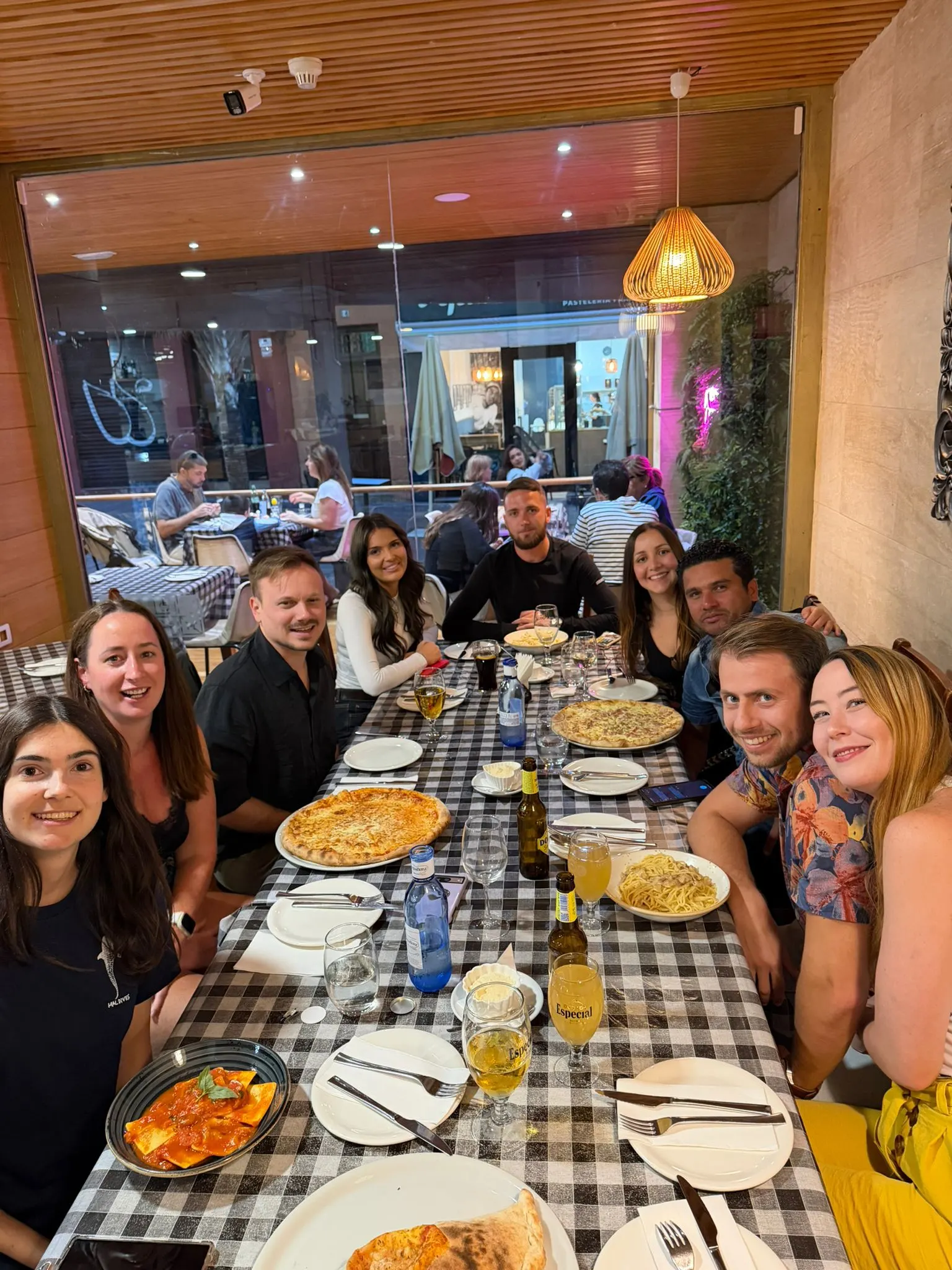 Blue Paradise community sharing dinner at a restaurant table.